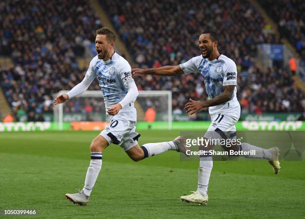 Gylfi Sigurdsson of Everton celebrates after scoring with team-mate Theo Walcott during the Premier League match between Leicester City and Everton...