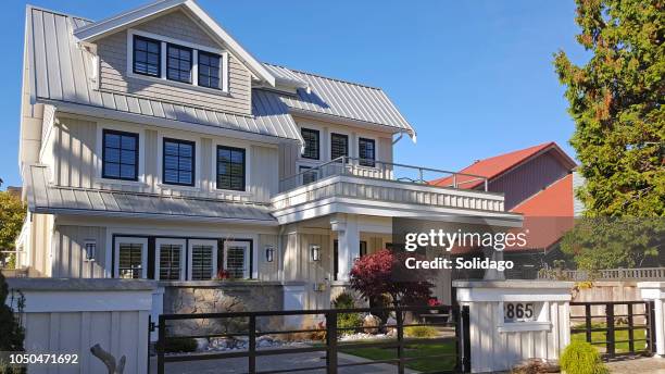 stunning board and batten coastal home - cedar beach stock pictures, royalty-free photos & images