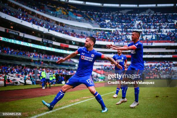 Edgar Mendez celebrates with teammate Elias Hernandez of Cruz Azul after scoring the winning goal during the 12th rond match between Cruz Azul and...