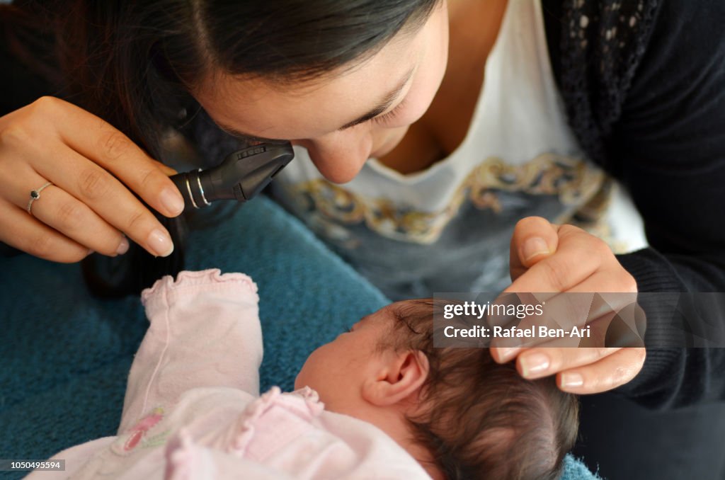 Midwife Checking Newborn Health