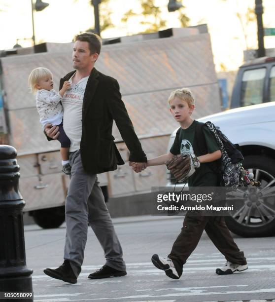 Ethan Hawke walks with his daughter Clementine Jane Hawke and son Levon Roan Thurman-Hawke in Midtown Manhattan on October 7, 2010 in New York City.