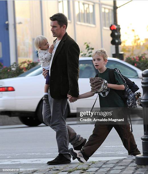 Ethan Hawke walks with his daughter Clementine Jane Hawke and son Levon Roan Thurman-Hawke in Midtown Manhattan on October 7, 2010 in New York City.