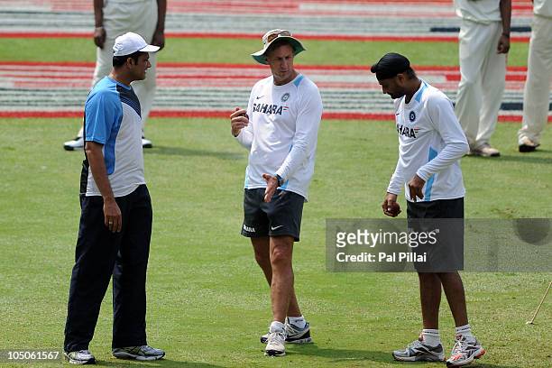 Anil Kumble , former Indian cricketer Eric Simmons, Indian bowling coach and Harbhajan Singh during an India nets session at M. Chinnaswamy Stadium...
