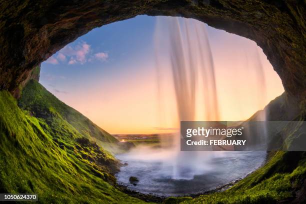 seljalandsfoss in summer. - cave stock pictures, royalty-free photos & images
