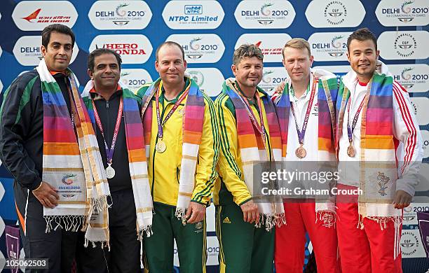 From left Manavjit Singh Sandhu and Mansher Singh from India win silver, Adam Vella and Michael Diamond from Australia win gold and Dave Kirk and...