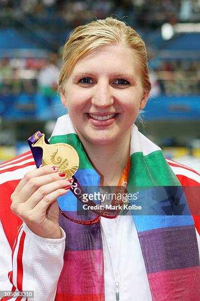 Rebecca Adlington of England poses with the gold medal during the medal ceremony for the Women's 400m Freestyle Final at Dr. S.P. Mukherjee Aquatics...