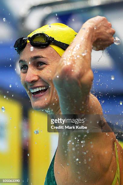 Sophie Edington of Australia celebrates finishing the Women's 50m Backstroke Final in first place and wins the gold medal at Dr. S.P. Mukherjee...