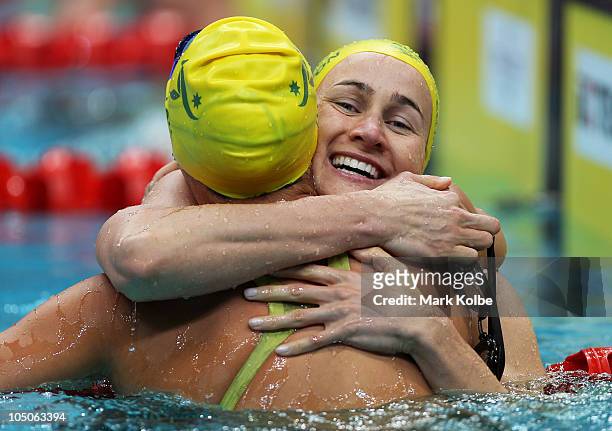 Sophie Edington of Australia celebrates finishing the Women's 50m Backstroke Final in first place and wins the gold medal at Dr. S.P. Mukherjee...