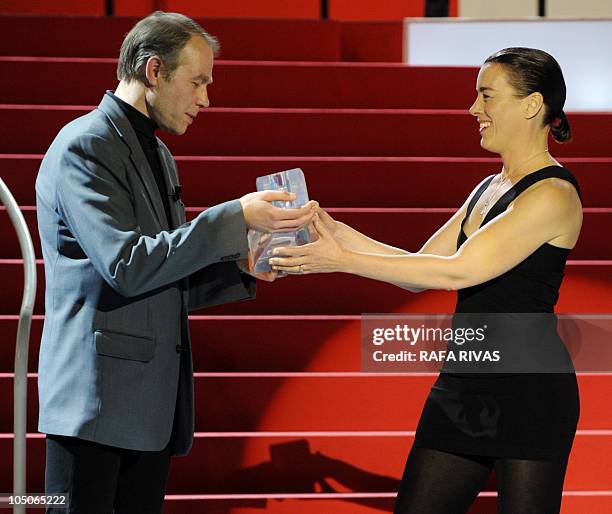 British actress Olivia Williams reacts as she receives the Fipresci award for Roman Polanski's film "The Writer" from Fipresci president Andrei...