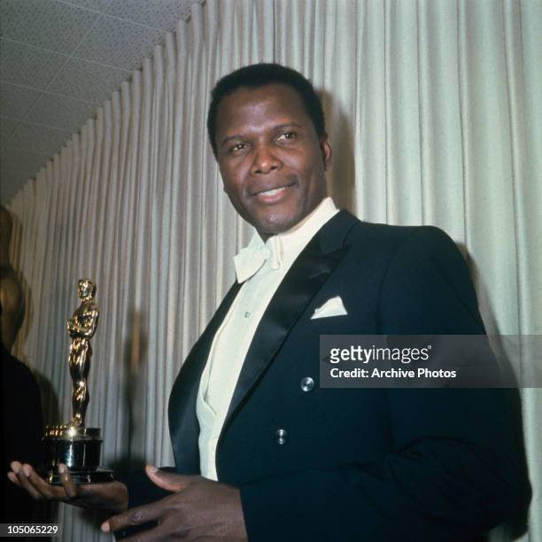 Bahamian-American actor Sidney Poitier at the 39th Academy Awards in Santa Monica, Los Angeles, 10th April 1967. He is presenting the award for Best...