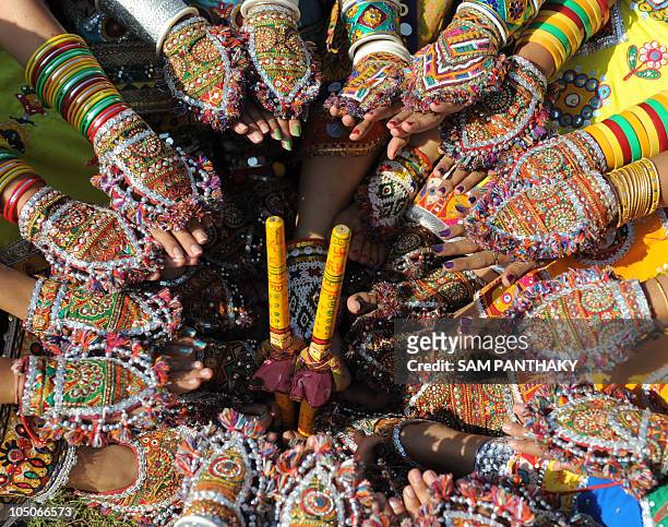 Indian dancers from the Ghunghat Group display decorated hands and feet as they participate during a full traditional dress rehearsal in preparation...