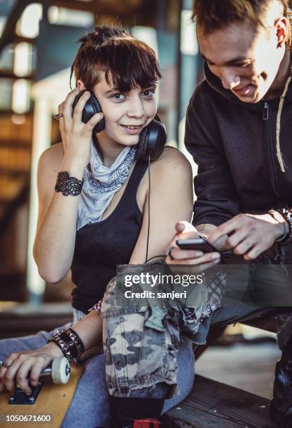 teenager couple hanging out in the getto - boys and girls town stock pictures, royalty-free photos & images