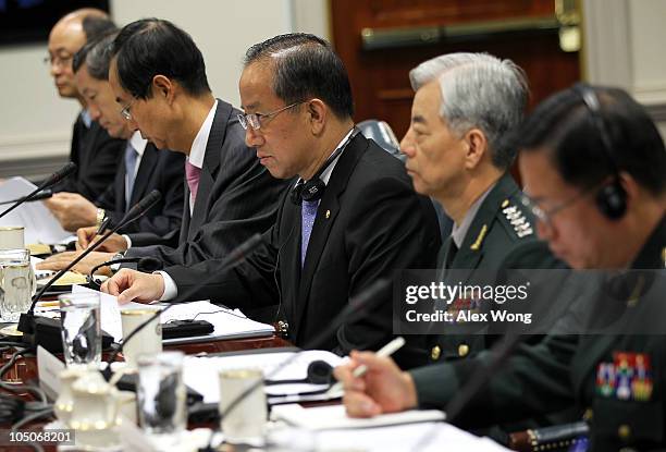 South Korean Minister of National Defense Kim Tae-young and his delegation listen during a meeting with U.S. Secretary of Defense Robert Gates and...