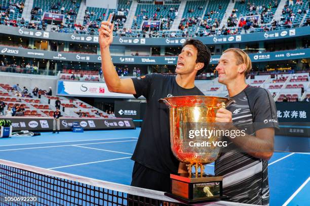 Lukasz Kubot of Poland and Marcelo Melo of Brazil take a selfie with their trophy after winning the Men's doubles final match against Oliver Marach...