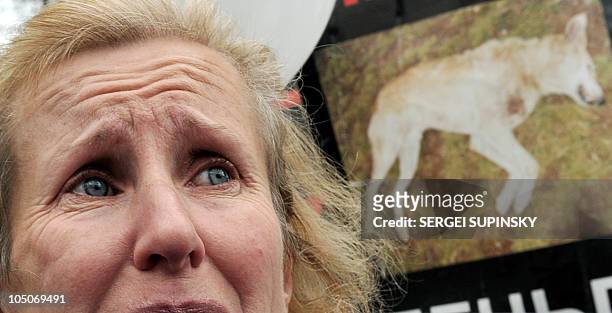 Woman cries during a rally organized by animal-rights activists in front of the Ukrainian Parliament in Kiev on October 5, 2010. The protesters...