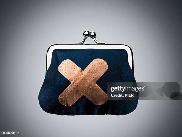 clasp purse with sticking plaster stuck to it - purse stock pictures, royalty-free photos & images