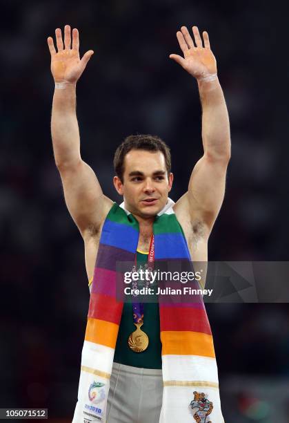 Joshua Jefferis of Australia celebrates winning gold in the parallel bars at IG Sports Complex during day five of the Delhi 2010 Commonwealth Games...