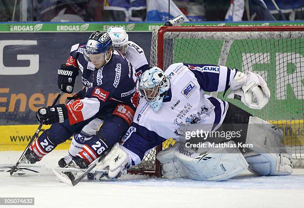 Florian Busch of Berlin battles for the puck with Marc Lamothe of Hamburg during the DEL Bundesliga match between EHC Eisbaeren Berlin and Hamburg...