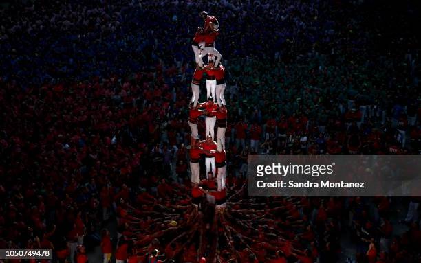 Members of the Castellers de Barcelona build a human tower during the 27th Tarragona Competition on October 07, 2018 in Tarragona, Spain. The...