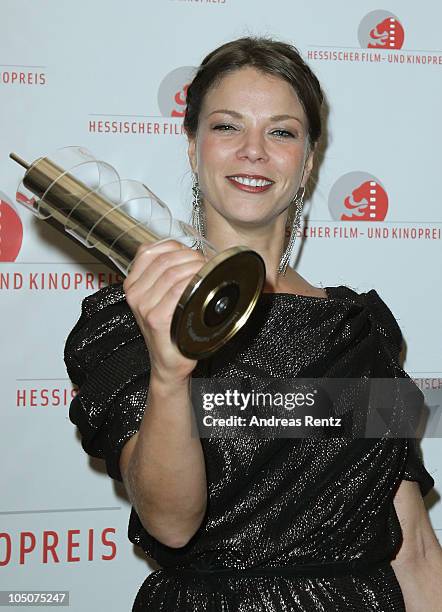 Actress Jessica Schwarz poses with the award during the 'Hesse Movie Award 2010' at the Alte Oper on October 8, 2010 in Frankfurt am Main, Germany....