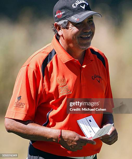 Eduardo Romero of Argentina smiles after making a birdie on the ninth green during the second round of the Constellation Energy Senior Players...