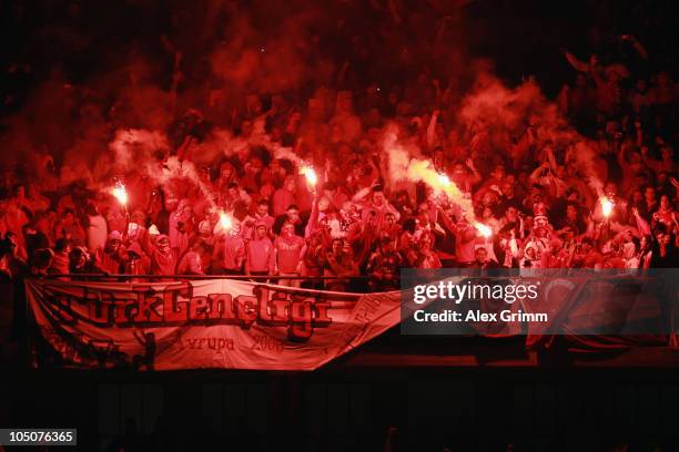 Supporters of Turkey light flares during the EURO 2012 group A qualifier match between Germany and Turkey at the Olympic Stadium on October 8, 2010...