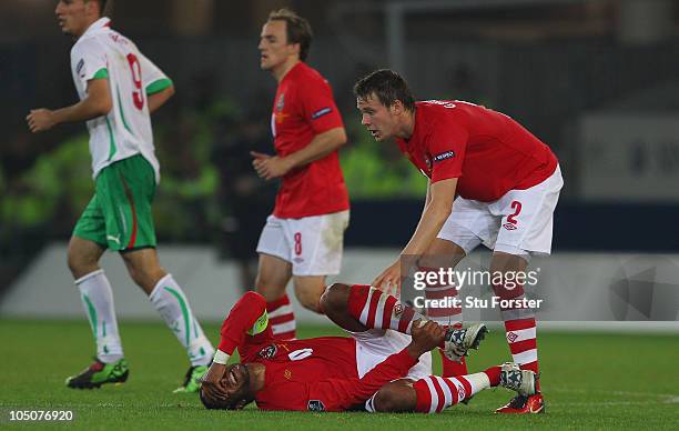 Wales captain Ashley Williams goes down injured during the EURO 2012 Group G Qualifier between Wales and Bulgaria at Cardiff City Stadium on October...