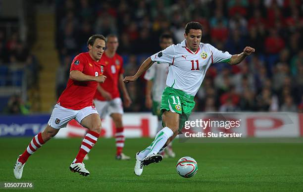 Wales player David Vaughan chases after Bulgaria player Dimitar Rangelov during the EURO 2012 Group G Qualifier between Wales and Bulgaria at Cardiff...