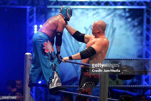 Wrestling fighters Kane and Rey Misterio fight during the WWE Smackdown Wrestling at Arena Monterrey on October 7, 2010 in Monterrey, Mexico.