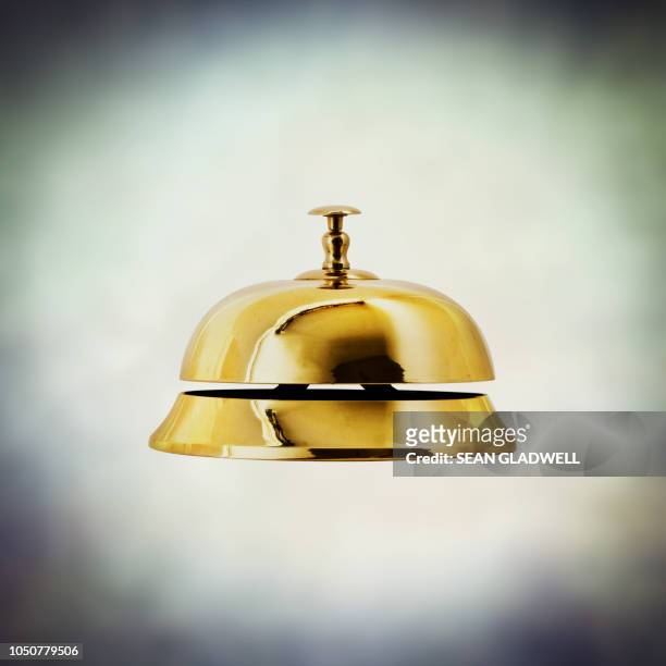 brass service bell side view - campana fotografías e imágenes de stock