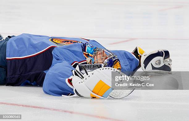 Goaltender Ondrej Pavelec of the Atlanta Thrashers lays on the ice after he fell backwards in the first few minutes of the first period against the...