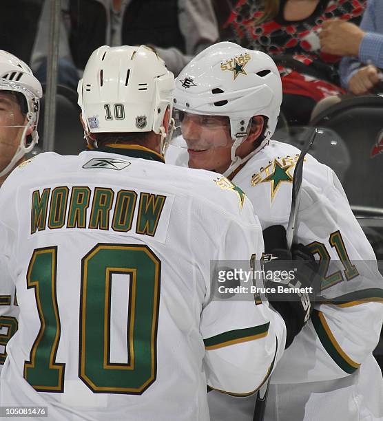 Brenden Morrow of the Dallas Stars congratulates Loui Eriksson on his overtime winning goal against the New Jersey Devils at the Prudential Center on...