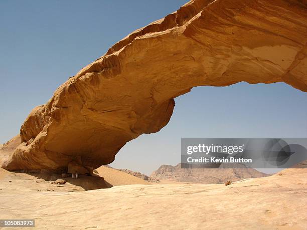 the rock bridge of kharaz - wadi rum, jordan - natural arch stock pictures, royalty-free photos & images
