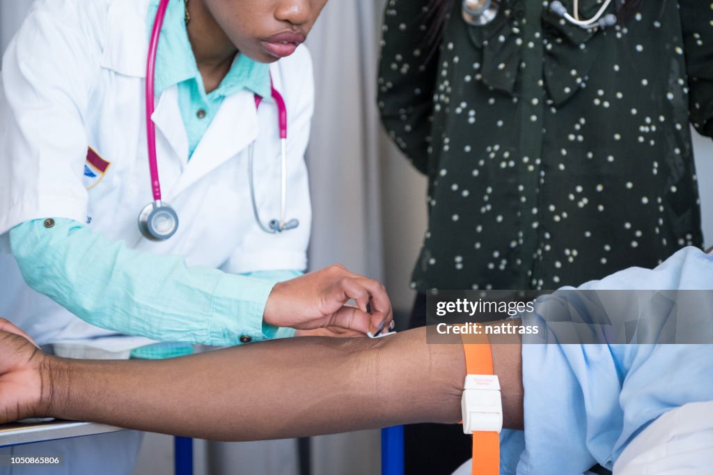 Patient Arm Injection Preparing The Patients Arm For An Injection High-Res Stock Photo ...