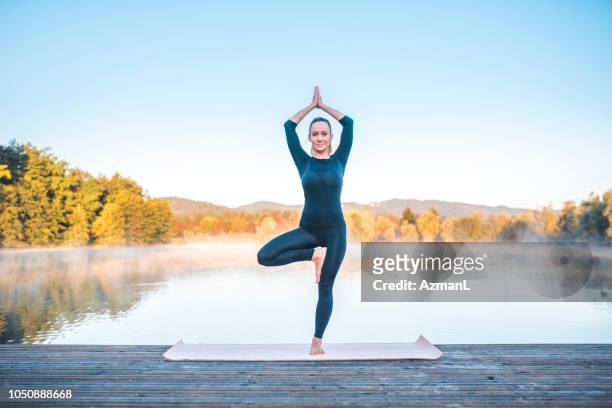 yoga pose - tree pose (vrksasana) - tree position stock pictures, royalty-free photos & images