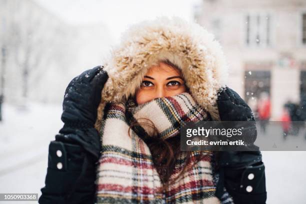 woman in snowy winter - warm clothing stock pictures, royalty-free photos & images