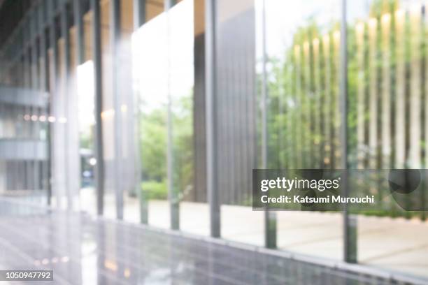 blurred abstract glass wall building background - wall background ストックフォトと画像