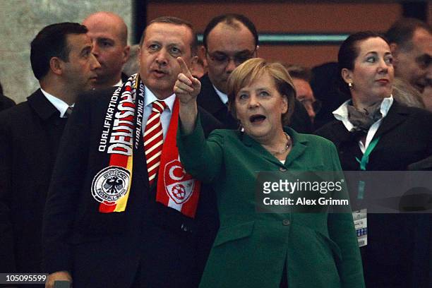 German Chancellor Angela Merkel and Turkish Prime Minister Recep Erdogan chat before the EURO 2012 group A qualifier match between Germany and Turkey...