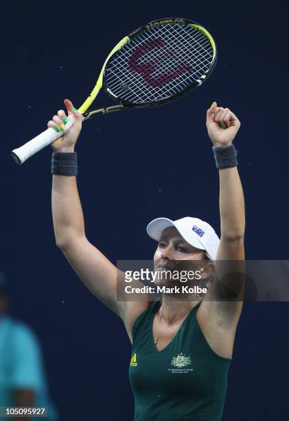 Anastasia Rodionova of Australia celebrates after winning the gold medal in her women's singles final match against Sania Mirza of India at RK Khanna...