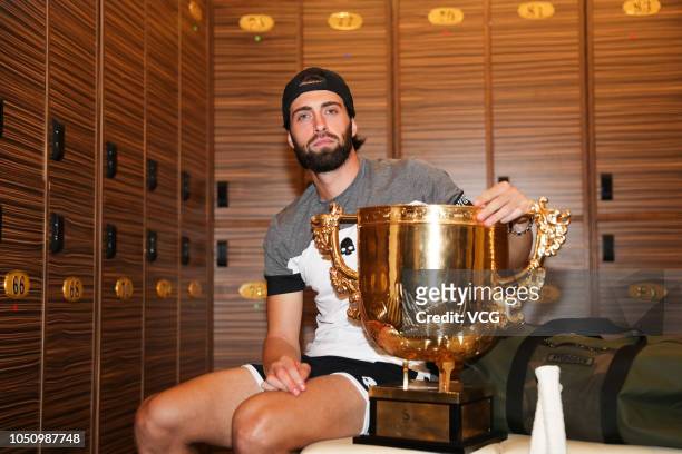 Nikoloz Basilashvili of Georgia poses with the trophy after winning the Men's Singles final match against Juan Martin del Potro of Argentina on day...