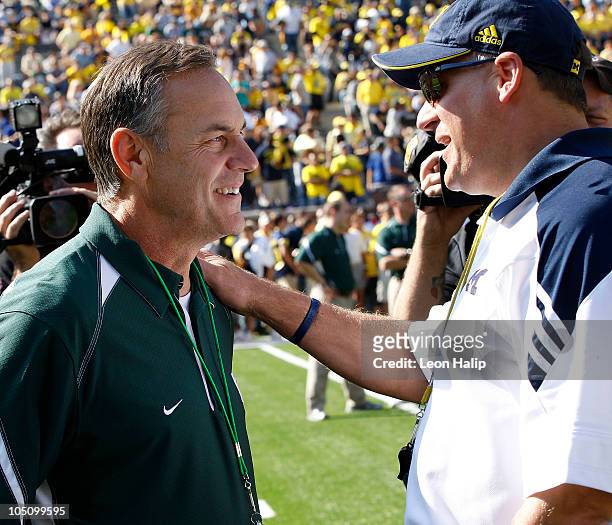 Michigan State head coach Mark Dantonio and Michigan head coach Rich Rodriguez meet prior to the start of the game October 9, 2010 at Michigan...
