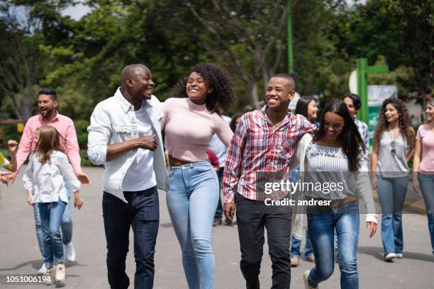 happy family having fun at an amusement park - colombia festival stock pictures, royalty-free photos & images