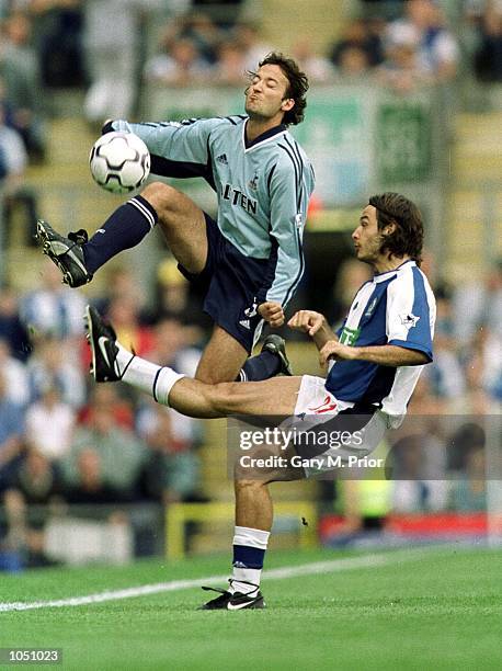 Corrado Grabbi of Blackburn clashes with Mauricio Taricco of Spurs during the Blackburn Rovers v Tottenham Hotspur FA Barclaycard Premiership match...