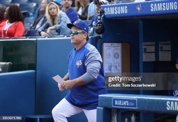 Manager John Gibbons of the Toronto Blue Jays walks out of the dugout to deliver the lineup card to the umpires on his final home game as manager...