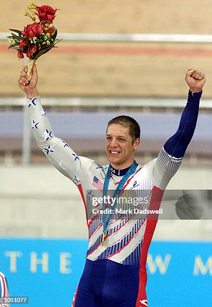 Marty Nothstein of USA celebrates winning the gold medal in the men's sprint final during the Sydney 2000 Olympic Games at the Dunc Gray Velodrome,...