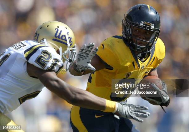 Shane Vereen of the California Golden Bears runs for a touchdown against Aaron Hester of the UCLA Bruins in the first half at California Memorial...