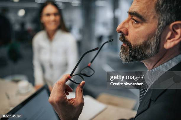 profile view of a pensive businessman on a meeting. - customer profile stock pictures, royalty-free photos & images