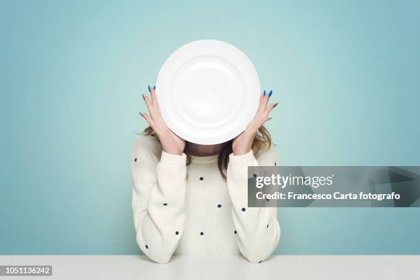 eating issues - woman empty plate stock pictures, royalty-free photos & images