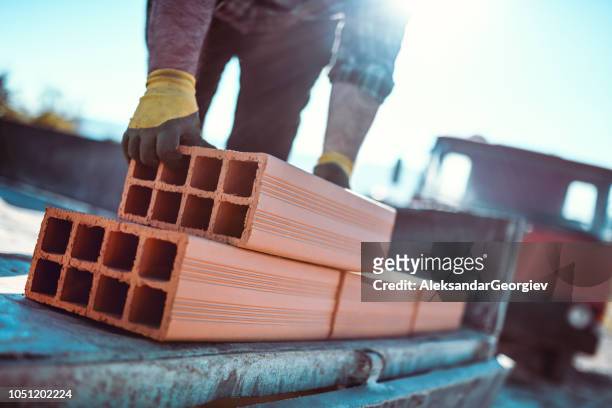 construction workers is holding hollow block - hollow stock pictures, royalty-free photos & images
