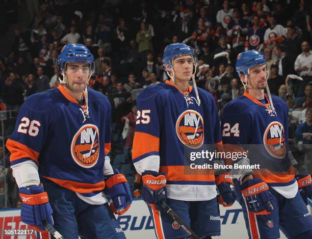 Nino Niederreiter of the New York Islanders lines up between Matt Moulson and Radek Martinek before playing in his first NHL game against the Dallas...